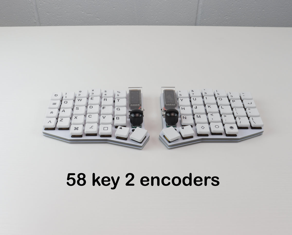 Two mechanical keyboards with 58 keys and two encoders on a white surface.